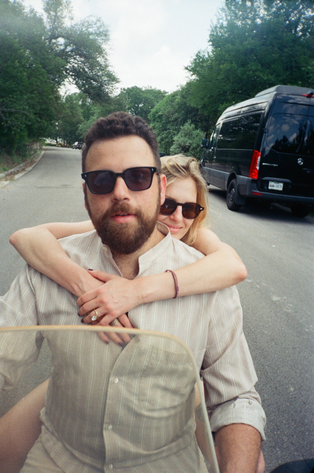 Alex and Stephen on a scooter, film-style